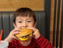 boy eating a burger