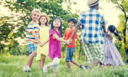 children holding hands in a circle